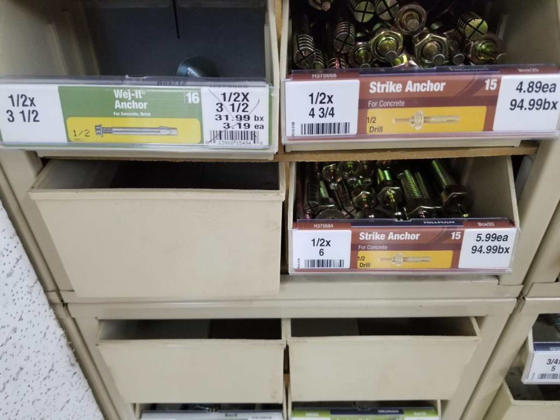 Full column section of bolt fastener display with bins and contents in bins and on top. - Image 11 of 12