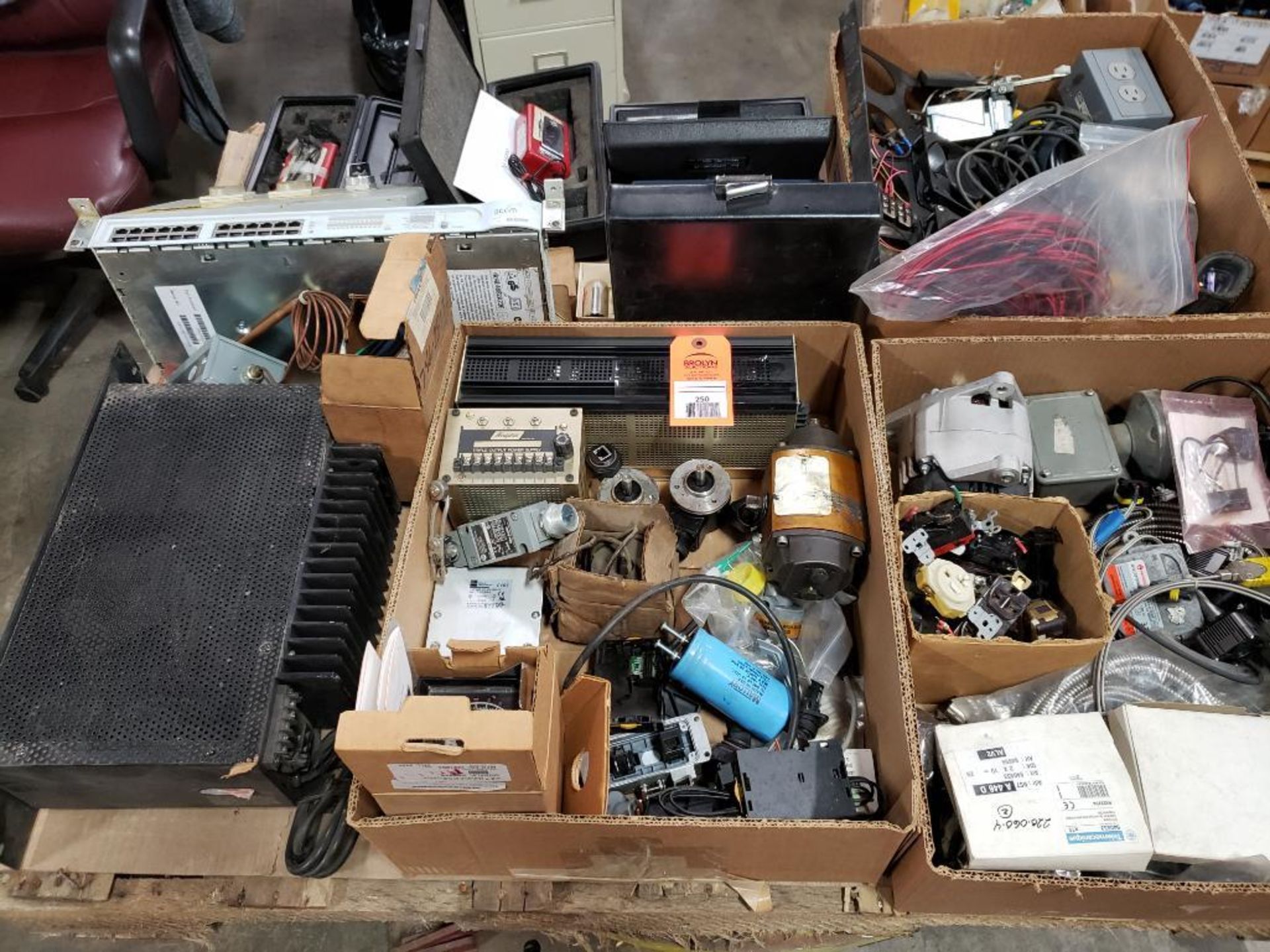 Pallet of assorted electrical. Plugs, power supply, meters, connectors.