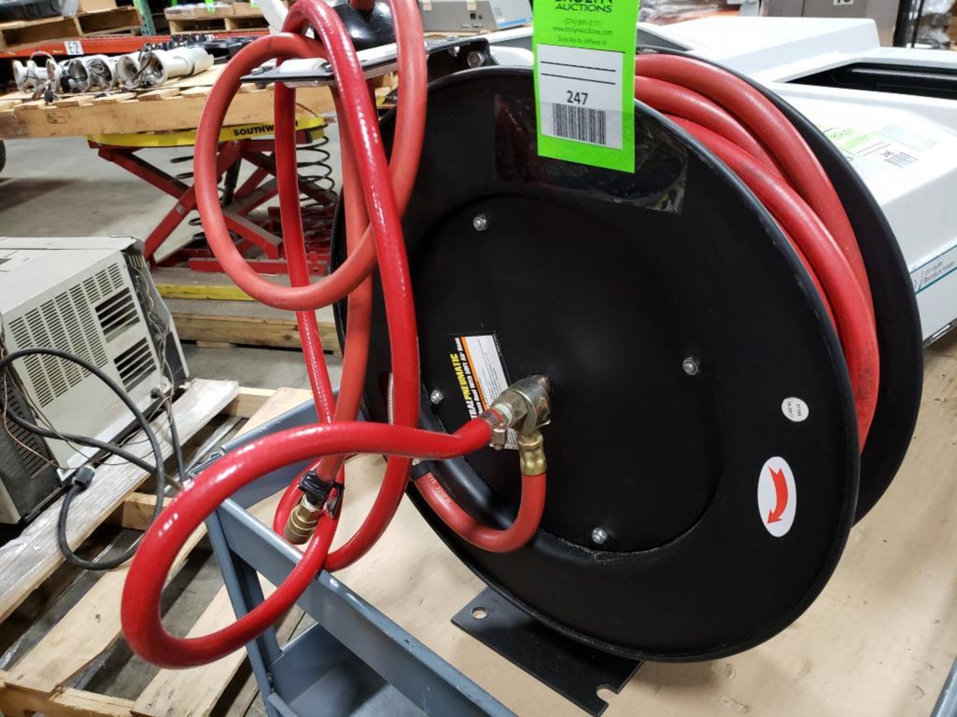 Central Pneumatic retractable hose reel with 50ft air hose.