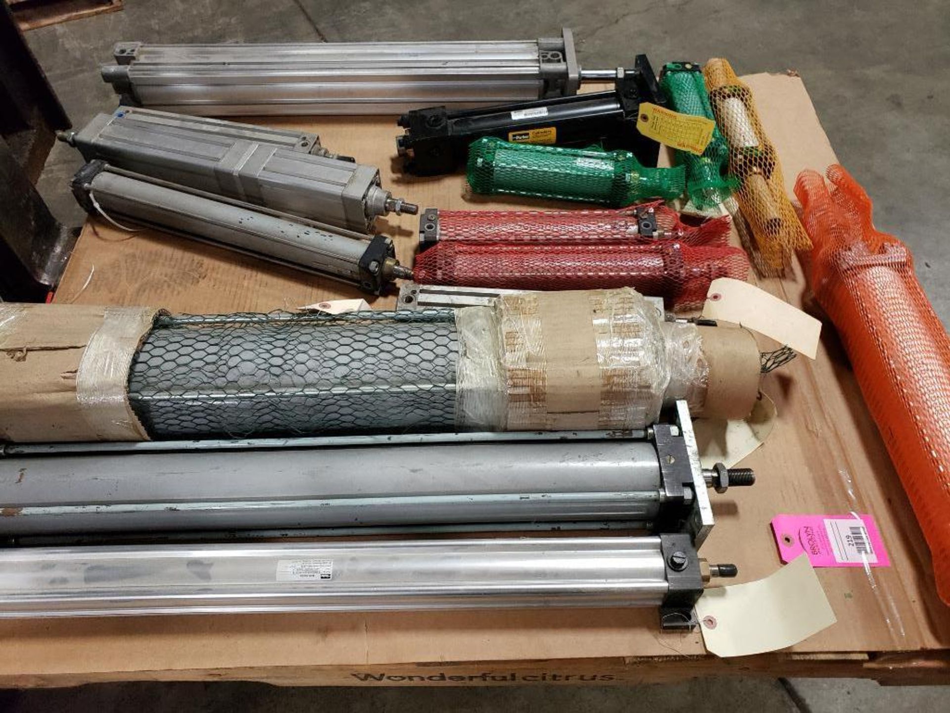 Pallet of assorted pneumatic cylinders. Pneumax, Parker, SMC.