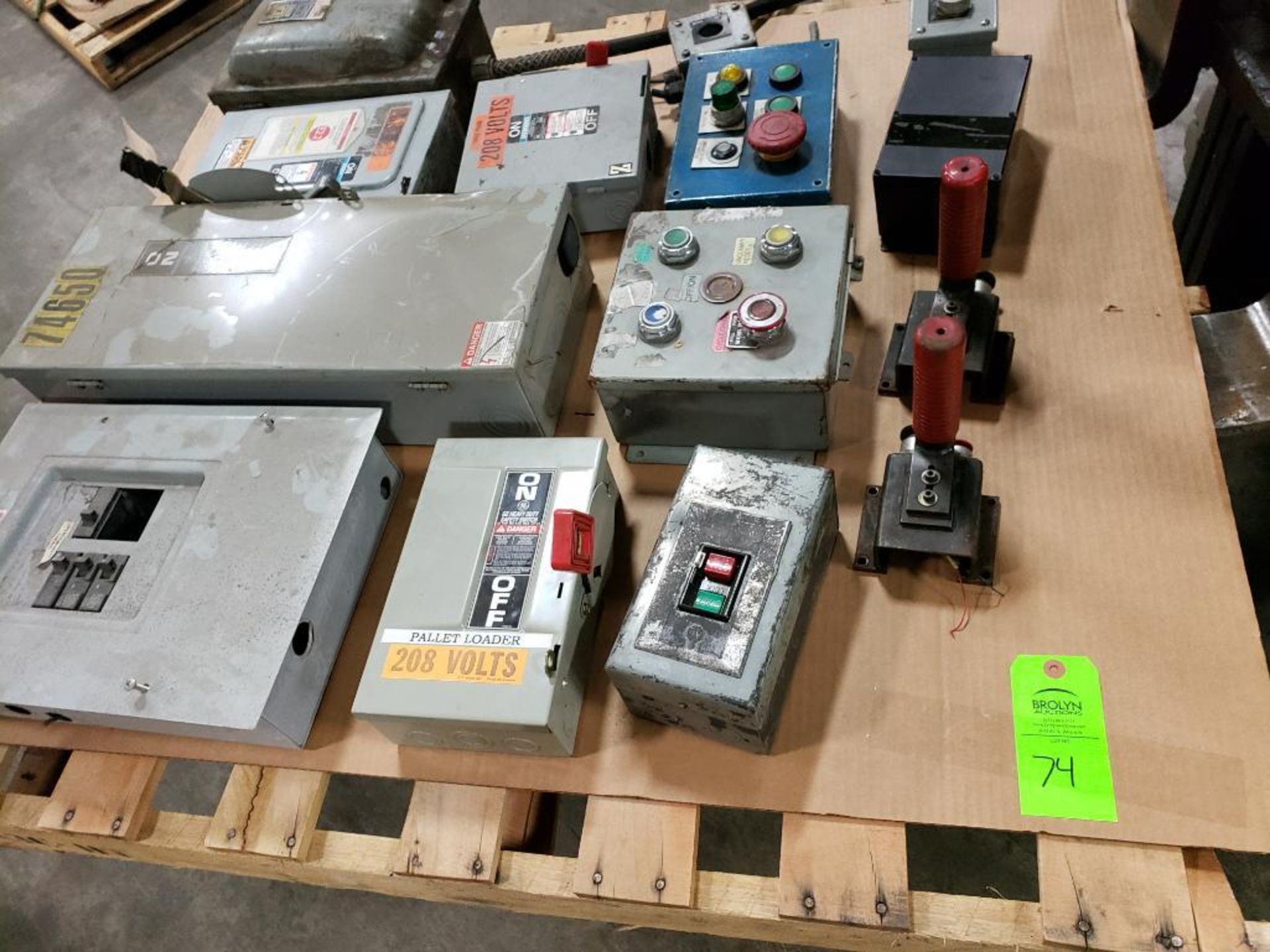 Pallet of assorted safety disconnects, breaker boxes, etc.