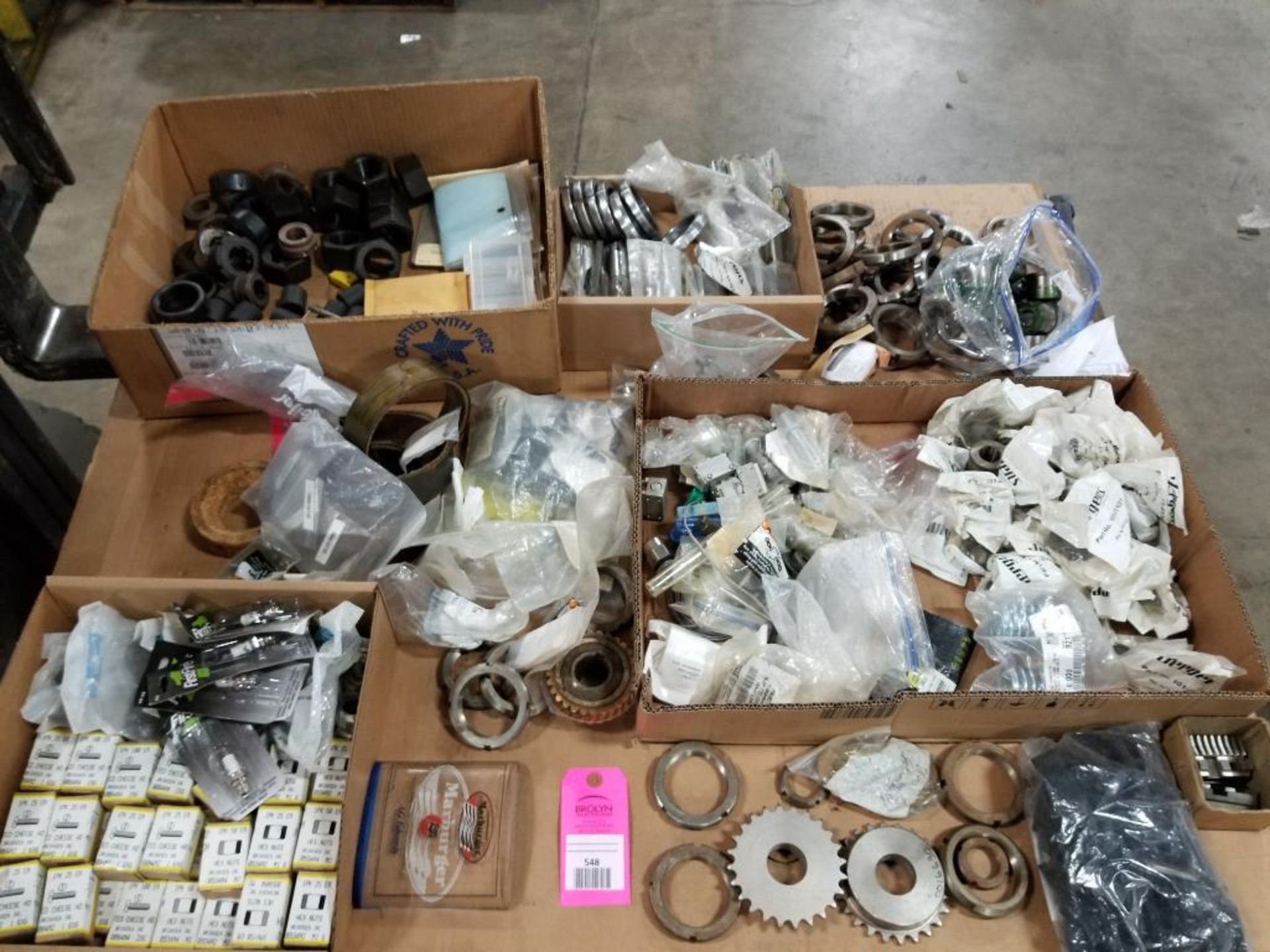 Pallet of assorted gears, rings, sleeves.