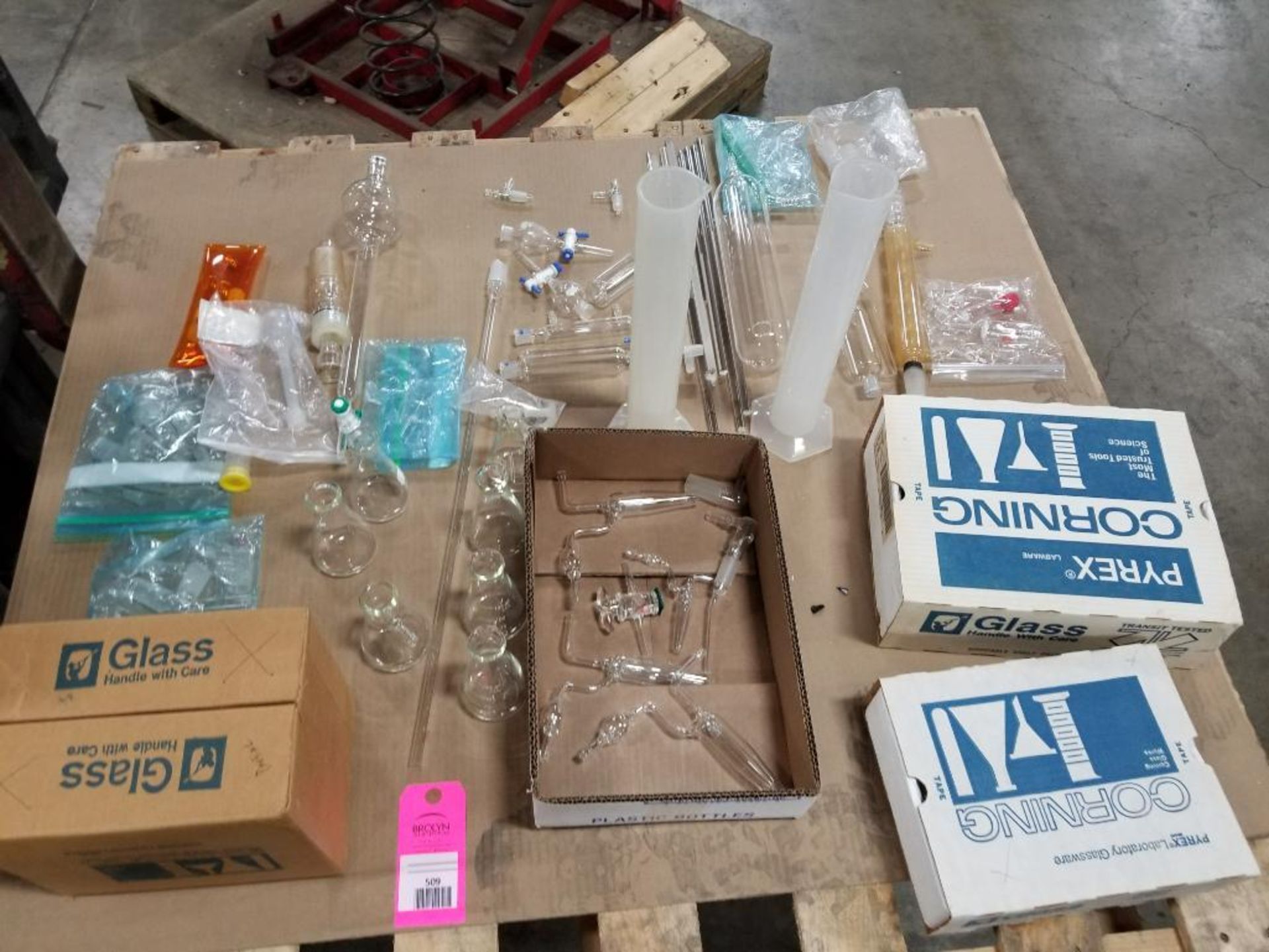 Pallet of assorted test equipment glassware. Corning.