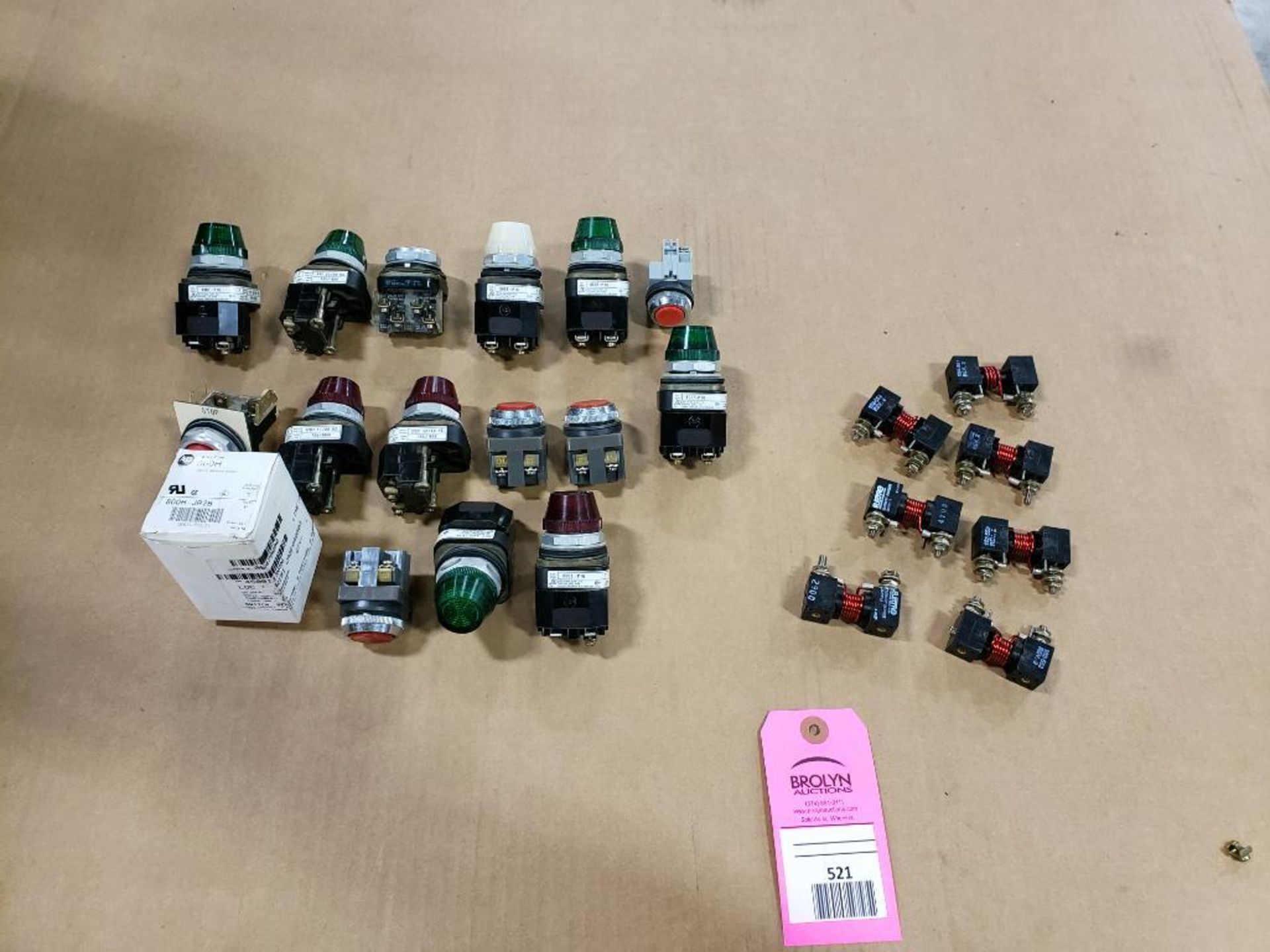 Assorted electrical buttons and relays.