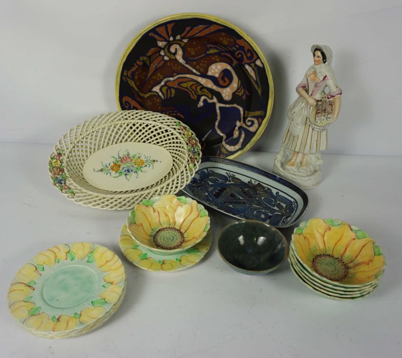 A quantity of decorative studio ceramics, including a Staffordshire figure of a fish seller, a