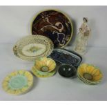 A quantity of decorative studio ceramics, including a Staffordshire figure of a fish seller, a