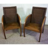 A pair of Loom rattan Colonial style armchairs, with bucket seats and a brown finish (2)Condition