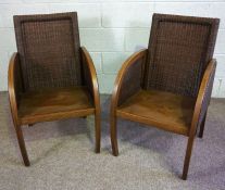 A pair of Loom rattan Colonial style armchairs, with bucket seats and a brown finish (2)Condition