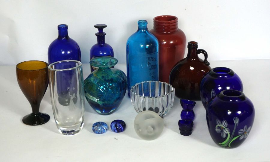 An assortment of coloured glass ware, including a Mdina globular blue glass vase, a pair of blue
