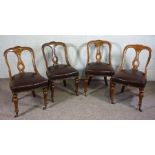 A set of four Victorian oak framed spoon and lyre backed dining chairs, with turned front legs (4)