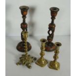 A pair of Kashmiri carved wood and painted lacquered candlesticks, with multi twist columns;