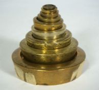 A graduated set of nine brass Imperial weights, largest 4lbs, smallest 1/4 oz. (9)