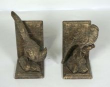 A pair of modern resin bookends, in the form of golden pheasants, 22cm high