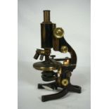 An E Leitz Wetzler brass microscope, No. 98995, early 20th century, with rotating three lens