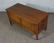 An Edwardian mahogany combined duet and sheet music stool, circa 1900, with three drop front drawers