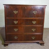 A George II style chest of drawers, early 20th century, with drop front top drawer and three further