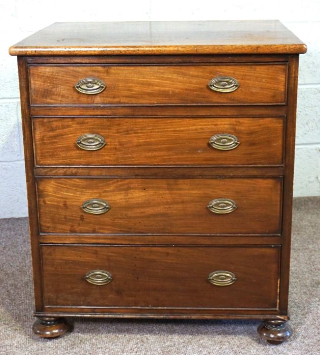 A small mahogany chest of drawers, 19th century, with four long drawers, on compressed bun feet,