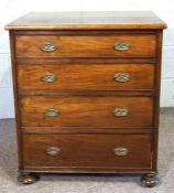 A small mahogany chest of drawers, 19th century, with four long drawers, on compressed bun feet,