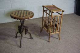 A Victorian games table, with circular chequer board top on cast iron base, 69cm high, 48cm