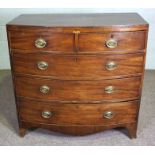 An early Victorian mahogany bowfront chest of drawers, circa 1840, with two short and three long