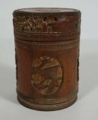 A Chinese bamboo box, Late Qing Dynasty or early Republic period, of canister form, carved