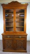 A modern stained beech dresser, mid 20th century, with a rack over two shelves and a pot board