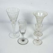 Four glasses, including a cordial glass, a 1970’s presentation air twist goblet, inscribed York,