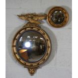 A small Regency style convex wall mirror, with eagle surmount, 70cm high, 43cm wide; together with a