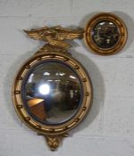 A small Regency style convex wall mirror, with eagle surmount, 70cm high, 43cm wide; together with a