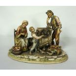 An Italian porcelain figure group of a Knife grinder and family, A Borsato, Milan, 20th century,