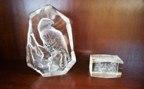 A glass boulder, carved with a Kestrel, 16cm high, together with a small glass paperweight decorated