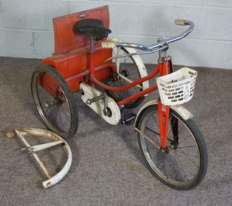 A vintage child’s tricycle with boot, 1950’s, together with a child’s’ play pram, a brassware