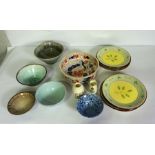 A small group of studio pottery, including four glazed bowls, an ironstone china Imari pattern bowl,