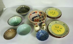 A small group of studio pottery, including four glazed bowls, an ironstone china Imari pattern bowl,