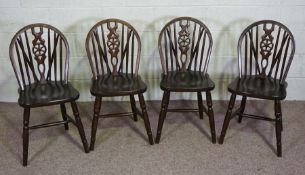 A set of four beech kitchen wheel backed chairs, modern (4)