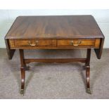 A George III style mahogany sofa table, 20th century, with a rounded rectangular drop leaf top