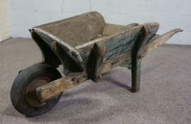 A garden wheelbarrow, 20th century, of planked high sided design, 160cm long, 80cm high