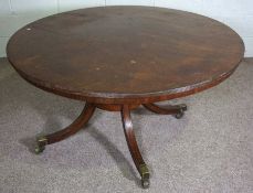 A George IV mahogany breakfast table, 19th century, with a circular tilting top with reeded edge set