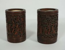 A pair of Chinese bamboo Bitong Brush Pots, Qing Dynasty, of typical cylindrical form, each carved