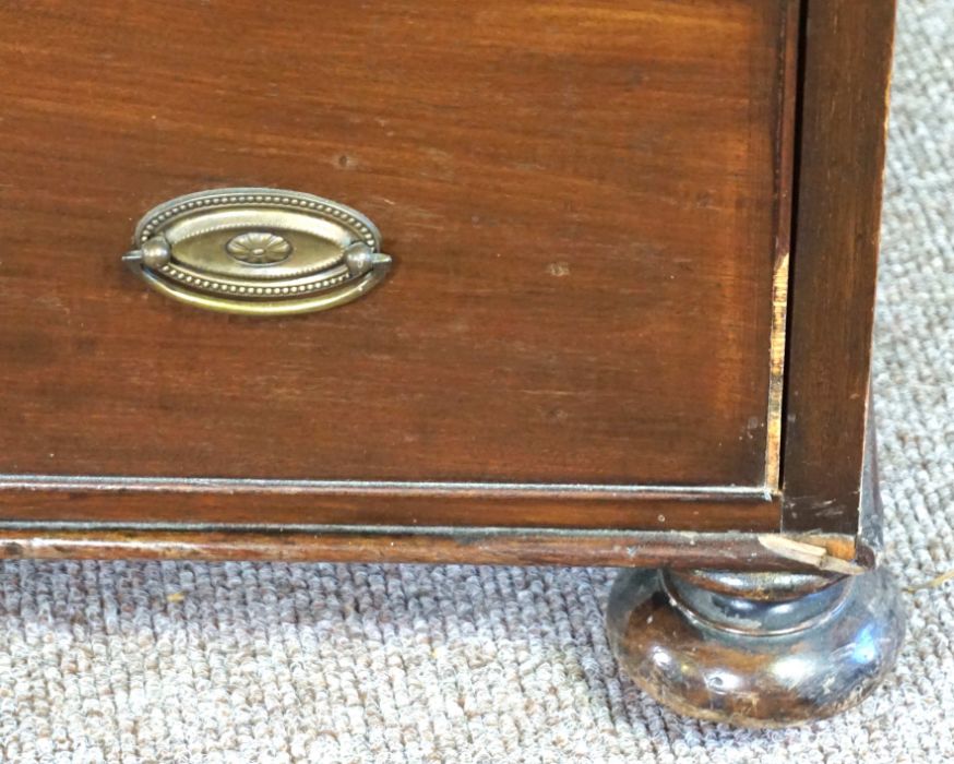 A small mahogany chest of drawers, 19th century, with four long drawers, on compressed bun feet, - Image 8 of 9