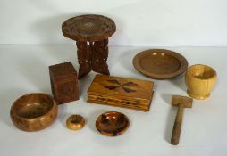 A small group of decorative carved wood objects, including five assorted turned bowls, a small caddy