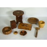 A small group of decorative carved wood objects, including five assorted turned bowls, a small caddy