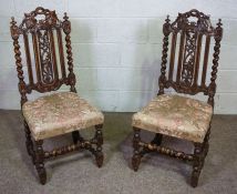 A pair of Jacobean style oak framed side chairs, early 20th century, with twist column supports