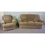 A modern three seat sofa and matching armchair, circa 2002, with beige upholstery, includes fire