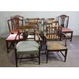 A set of four Regency simulated rosewood dining chairs, with carved ears, brass stringing and
