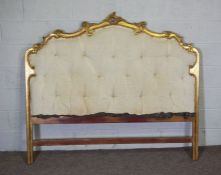 A George III style gilt wood and carved bedhead, with a matching gilt wood and upholstered canopy
