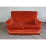 A small red two seat sofa, with scrolled arms and tassel fringe, 153cm wide; together with three
