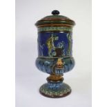 A Doulton stoneware water filter, circa 1880, decorated with a Grecian frieze on a blue and brown