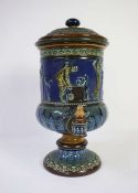 A Doulton stoneware water filter, circa 1880, decorated with a Grecian frieze on a blue and brown