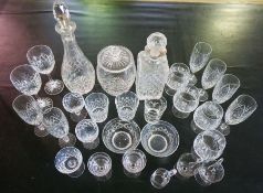 A large assortment of table glassware, including decanters (a lot)